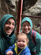 Picture of Ms. Vierheller, her husband, and daughter in front of a waterfall